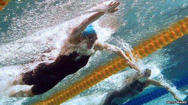 This picture taken with an underwater camera shows Camille Muffat (top) on her way to win the women's 200m freestyle final on April 12, 2012