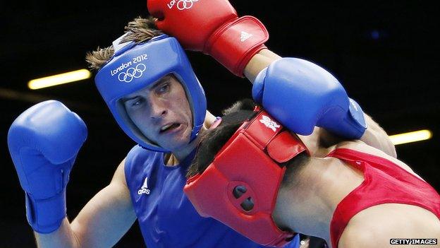 Tuvshinbat Byamba (R) of Mongolia defends against Alexis Vastine (L) of France during their round of 16 Welterwight (69kg) match of the London 2012 Olympic Games at the ExCel Arena on August 3, 2012