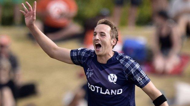 Josh Davey takes a World Cup wicket for Scotland