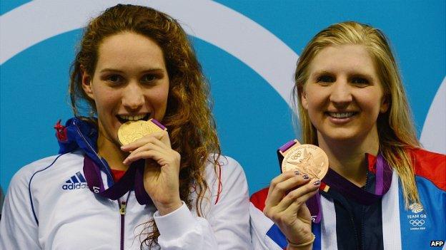 Camille Muffat (left) with her gold medal after winning the women's 400m freestyle at the London 2012 Olympics, in which British swimmer Rebecca Adlington (right) took bronze - 29 July 2012