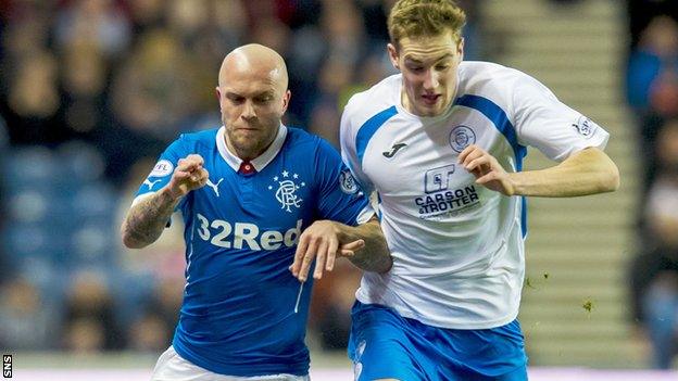 Rangers' Nicky Law battles with Kevin Holt of Queen of the South at Ibrox