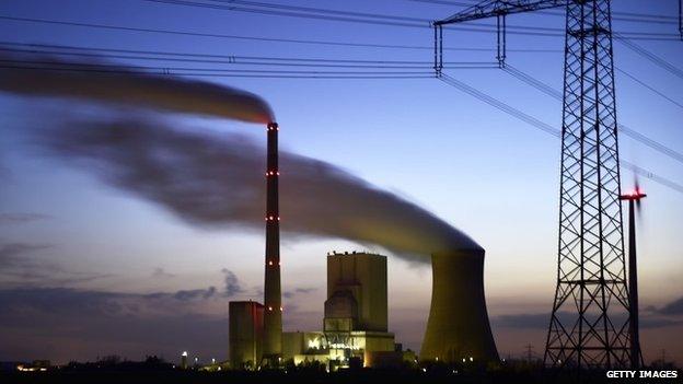 Steam rises from cooling towers at the coal-fired Kraftwerk Mehrum power plant at Haemelerwald