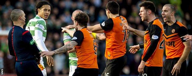 Celtic's Virgil Van Dijk is confronted by Dundee United players