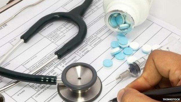 Doctor writing and stethoscope