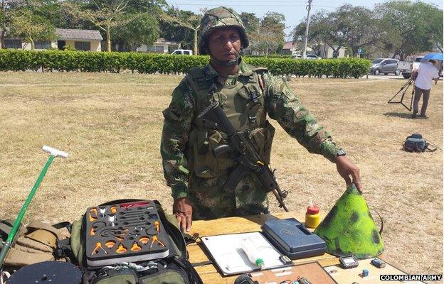 Sergeant Beltran demonstrates various types of mines