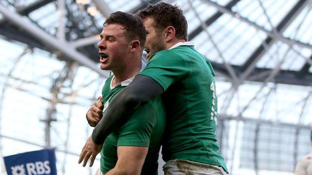 Robbie Henshaw celebrates with his Ireland centre partner Jared Payne after scoring the crucial try in the win over England