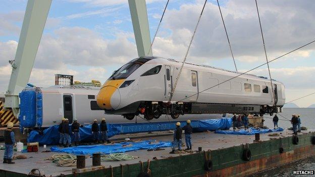 The Hitachi 800 training carriage is lifted off a boat