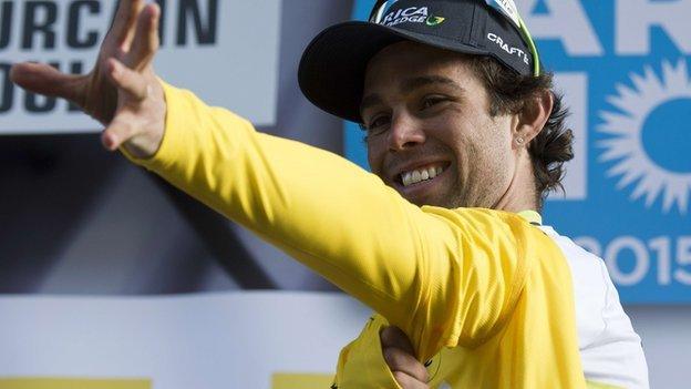 Michael matthews pulls on the yellow jersey