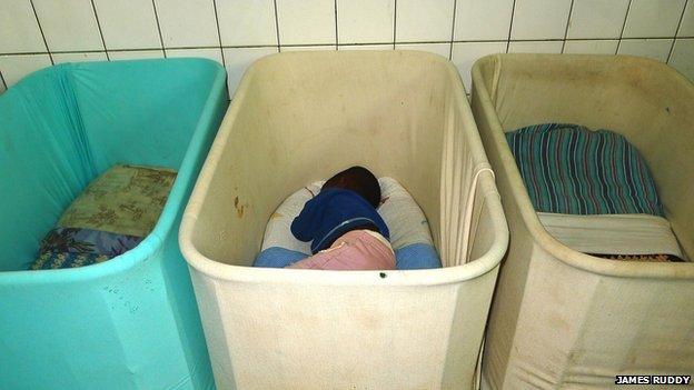 A child in a cot in Noel Orphanage in Rwanda