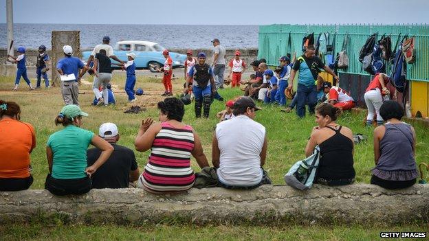 Children play baseball in Cubal