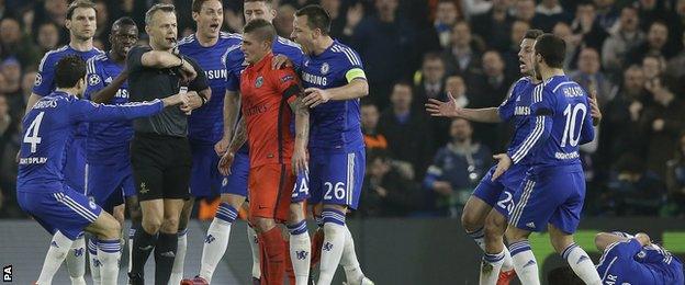 Chelsea players surrounded the referee