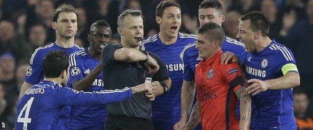 Chelsea players surrounded the referee