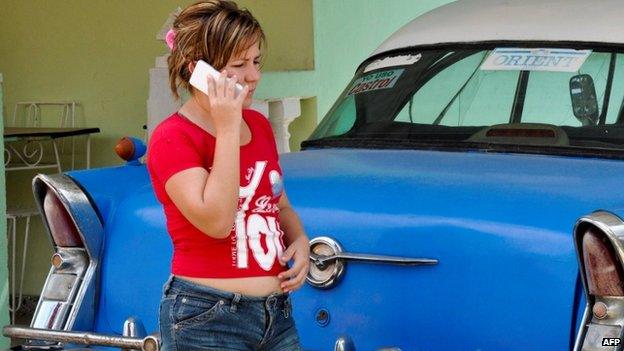 File photo: A woman uses a mobile phone in Havana