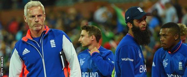 England coach Peter Moores and members of the side after defeat against Bangladesh