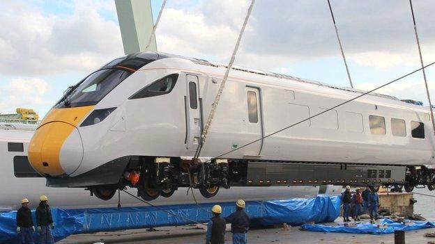 The Hitachi 800 training carriage is lifted off a boat