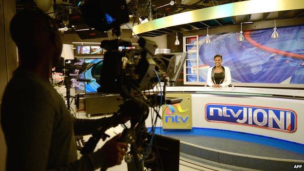 Kenya's Nation TV anchor Jane Ngoiri works on 11 March 2015 in Nairobi