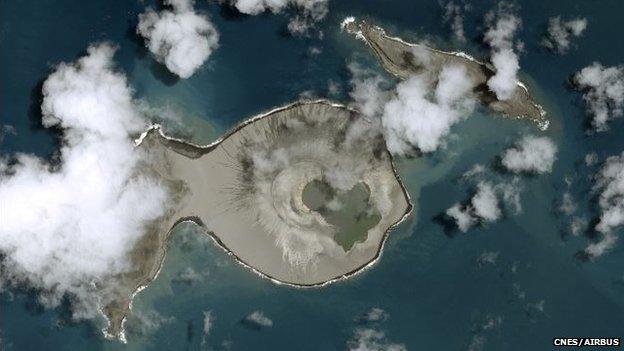 Satellite image showing two islands and large crater