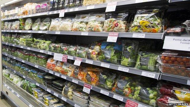 Shelves stacked with salad items