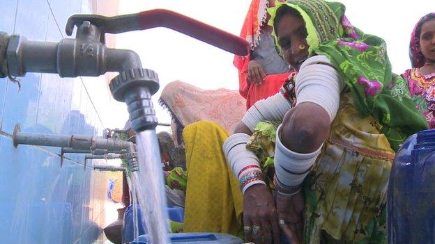 Women waiting at the taps