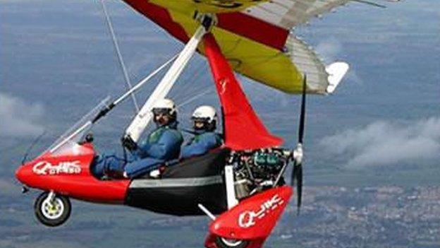 A red and yellow microlight