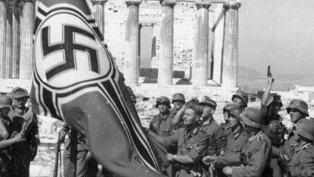 German soldiers raising the German war flag over the Acropolis