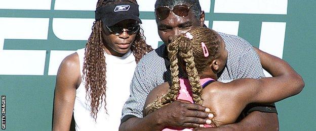 Serena Williams is congratulated by father Richard and sister Venus (left) after winning the 2001 final at Indian Wells