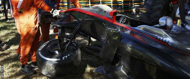 Kevin Magnussen of Denmark's car after he crashed during the second practice session of the Australian F1 Grand Prix at the Albert Park circuit in Melbourne