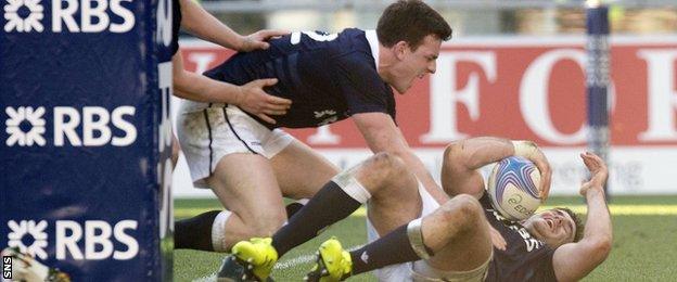 Scott celebrates with Dunbar after the latter's try against Italy last year