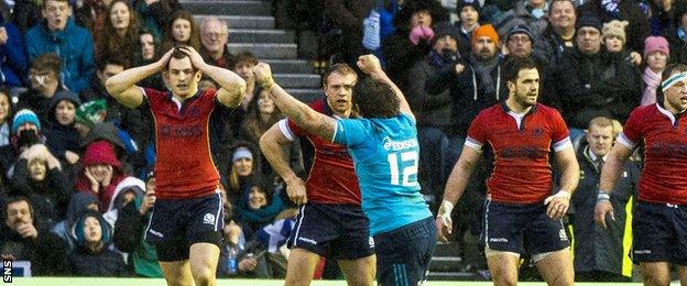 Scott, far left, and Dunbar, second right, look on as Italy celebrate their late win