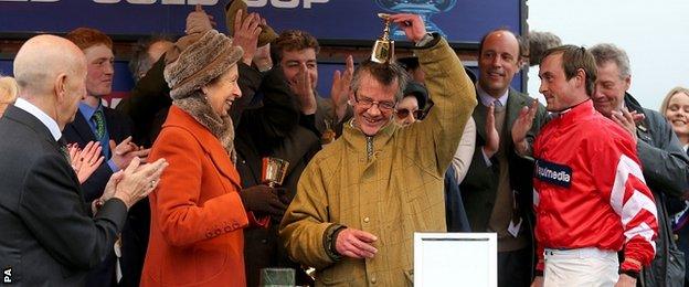 Trainer Mark Bradstock receives the trophy from The Princess Royal after Coneygree's victory