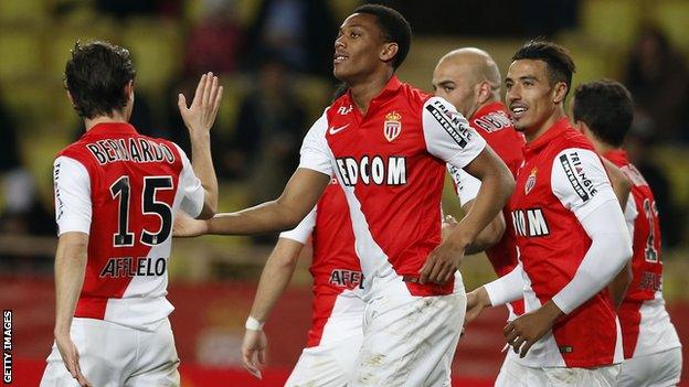 Monaco players celebrate