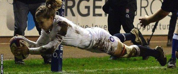 Fiona Pocock dives over to score for England