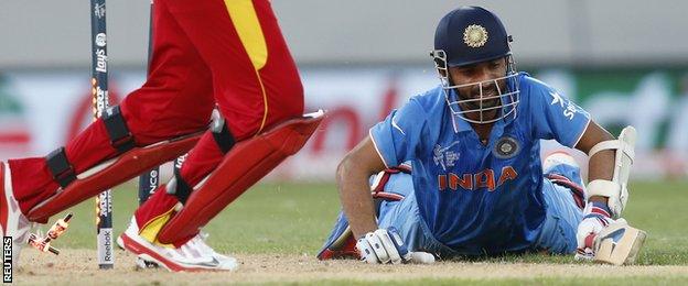 Ajinkya Rahane is run out for 19 by Sikanda Raza's throw