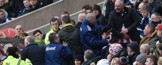 Sunderland fans attempt to get to Gus Poyet's dugout