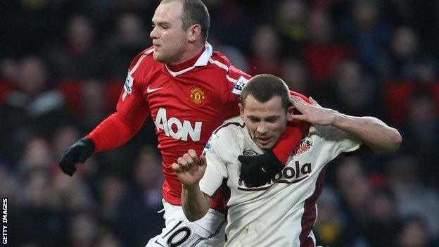 Manchester United's Wayne Rooney & Phil Bardsley