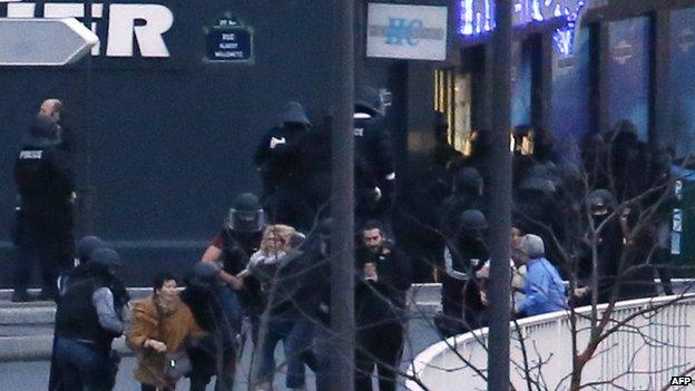 Police rescuing hostages from supermarket, 9 January 2013