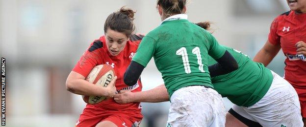 Wales' Sioned Harries is tackled by Alison Miller and Paula Fitzpatrick