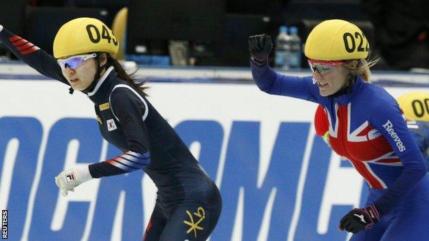 Elise Christie (right) celebrates silver in the 1000m