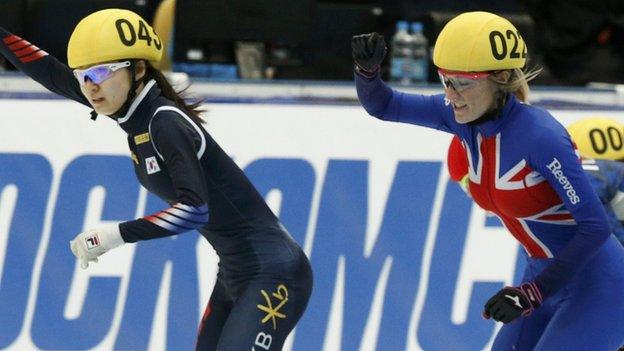 Elise Christie (right) celebrates silver in the 1000m
