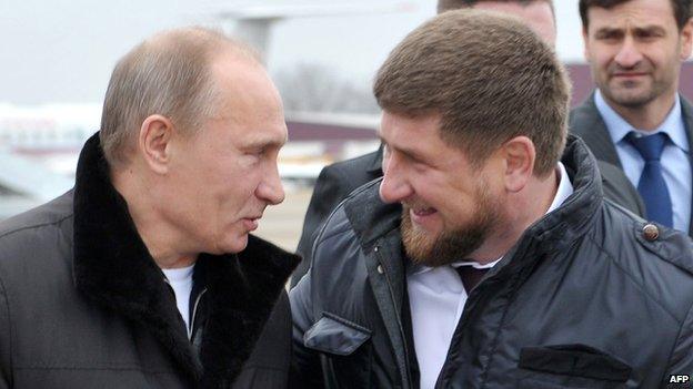 Russia's Prime Minister Vladimir Putin (L) speaks with Chechnya's leader Ramzan Kadyrov in Gudermes on 20 December 2011