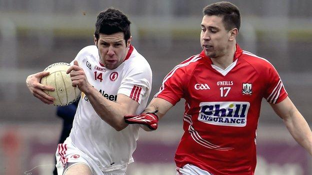 Tyrone's Sean Cavanagh attempts to get past Cork's Conor Dorman