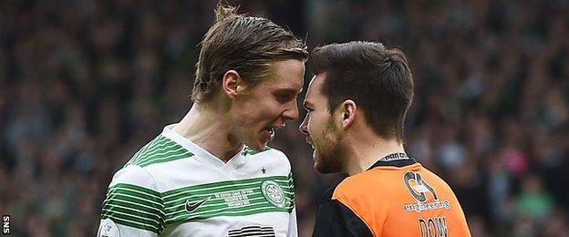 Celtic's Stefan Johansen squares up to Ryan Dow (right) after feeling the Utd man went down easily in the box.