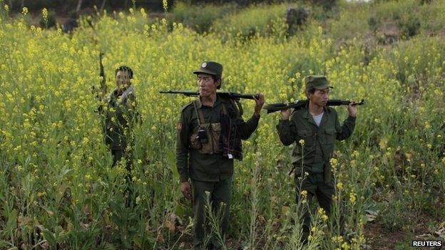 Rebel soldiers of Myanmar National Democratic Alliance Army (MNDAA) patrol near a military base in Kokang region, March 10, 2015.