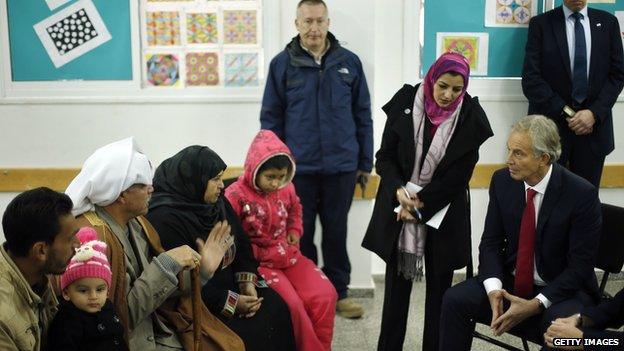 Middle East Quartet envoy Tony Blair visits a UN-run school sheltering Palestinians, whose houses were destroyed by what they said was Israeli shelling during the 50-day war last summer, in Gaza City on 15 February, 2015
