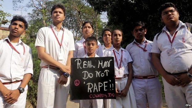 Indian students hold a poster as they protest near the convent school where an elderly nun was raped in Ranaghat, 79 km north of Calcutta, India, 16 March 2015.