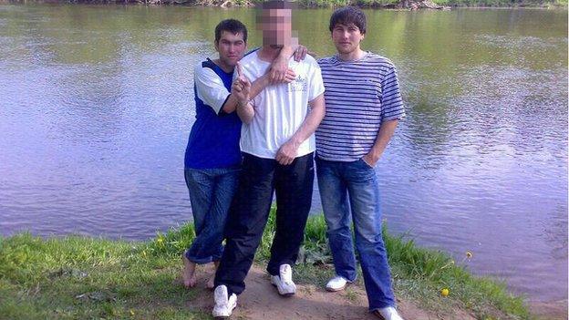 Anzor and Shagid Gubashev with a relative blurred in the middle