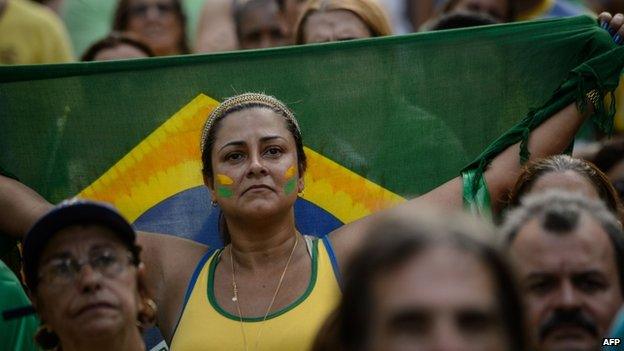 A protester holds a flag at a protest in Rio de Janeiro,