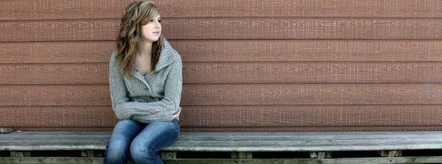 Lonely girl on bench