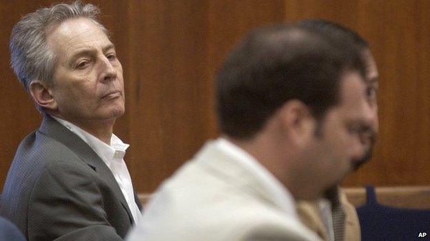 In this Aug. 18, 2003 file photo, Robert Durst, left, sits in a courtroom during a pre-trial hearing at the Galveston County Courthouse in Galveston, Texas.