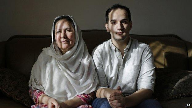 Shamim Syed, left, whose son Adnan was convicted for the 1999 murder of his ex-girlfriend poses for a photograph alongside her son Yusef in her home in Baltimore 10 December 2014